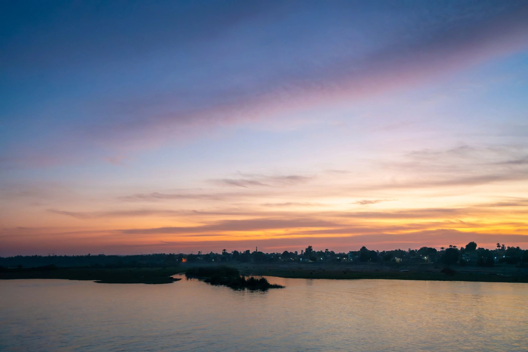 Serene river sunset landscape evoking river cruise travel