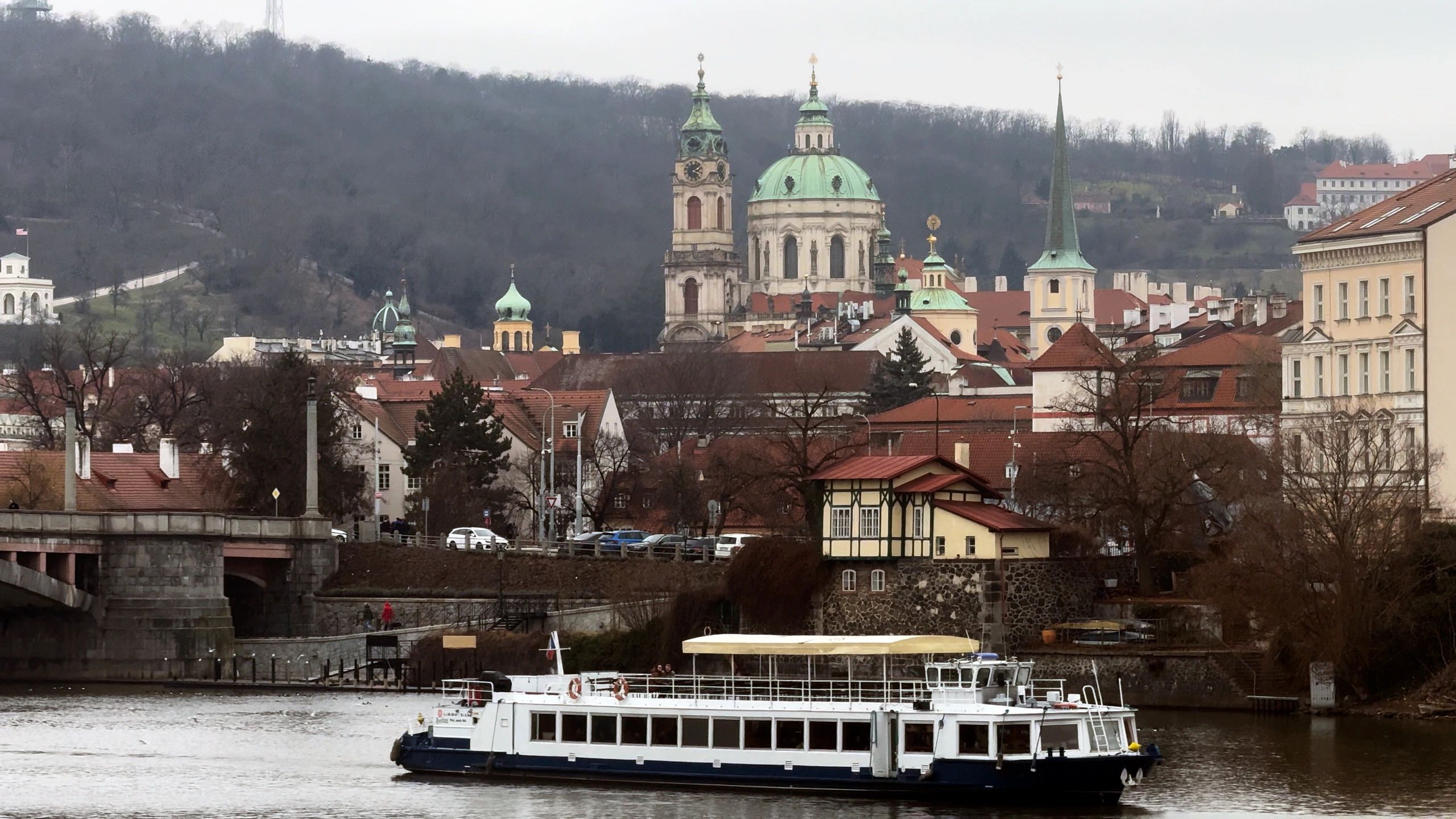 Historic riverside city skyline over the Vltava River in Prague