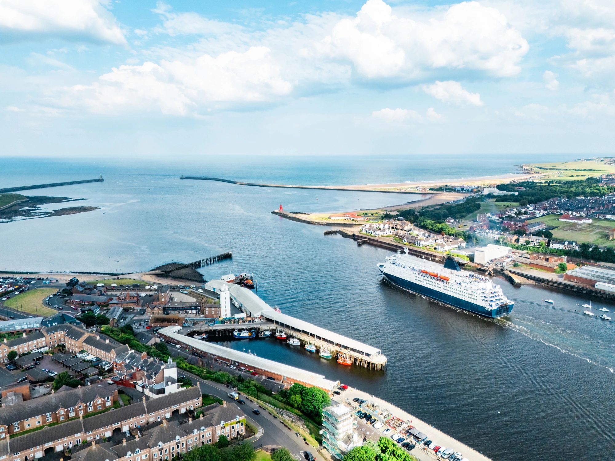 River cruise vessel traveling on a broad European waterway